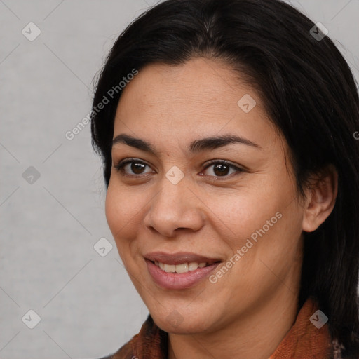 Joyful latino young-adult female with medium  brown hair and brown eyes