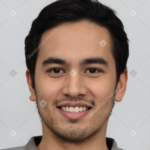 Joyful latino young-adult male with short  black hair and brown eyes