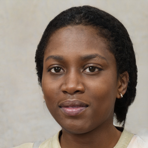 Neutral black young-adult female with medium  black hair and brown eyes
