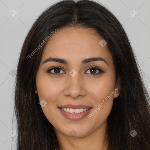 Joyful latino young-adult female with long  brown hair and brown eyes