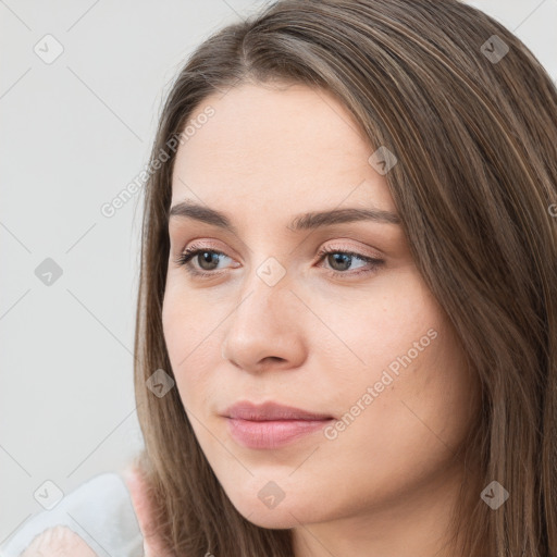 Neutral white young-adult female with long  brown hair and brown eyes