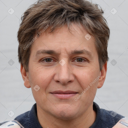 Joyful white adult male with short  brown hair and grey eyes