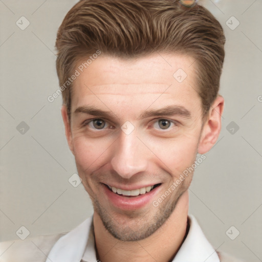 Joyful white young-adult male with short  brown hair and grey eyes