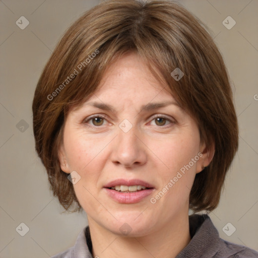 Joyful white adult female with medium  brown hair and grey eyes