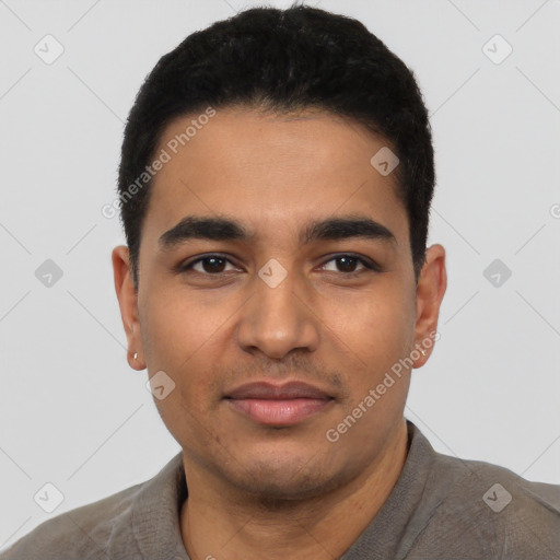 Joyful latino young-adult male with short  black hair and brown eyes