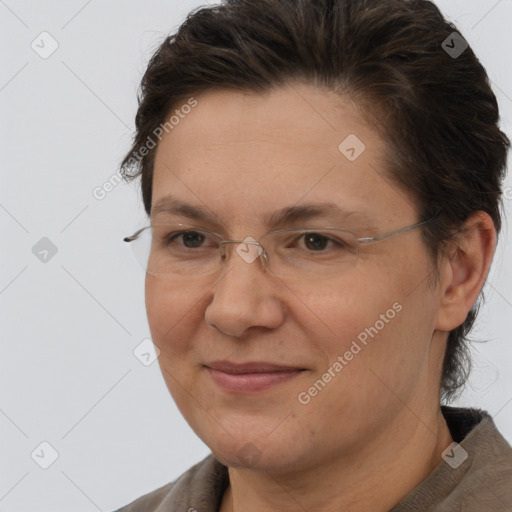 Joyful white adult female with short  brown hair and brown eyes