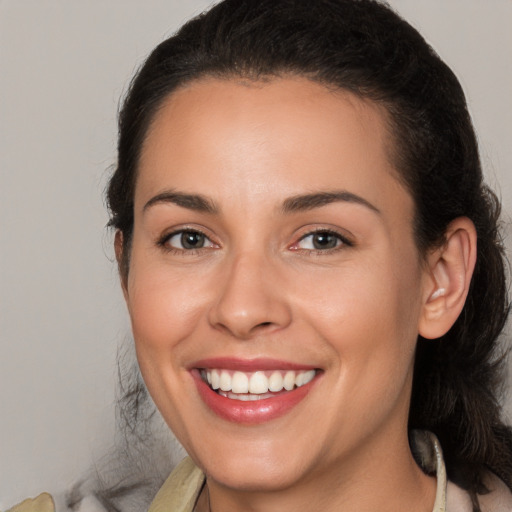 Joyful white young-adult female with medium  brown hair and brown eyes