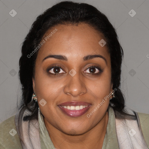 Joyful black young-adult female with long  brown hair and brown eyes