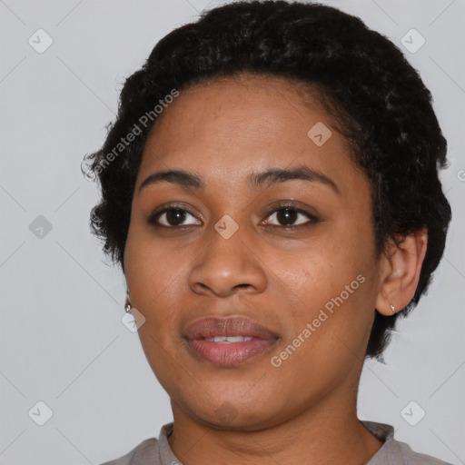 Joyful black young-adult female with short  black hair and brown eyes