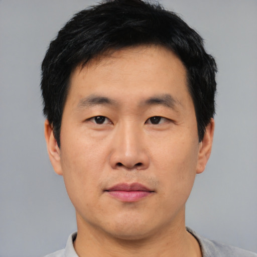Neutral asian young-adult male with short  black hair and brown eyes