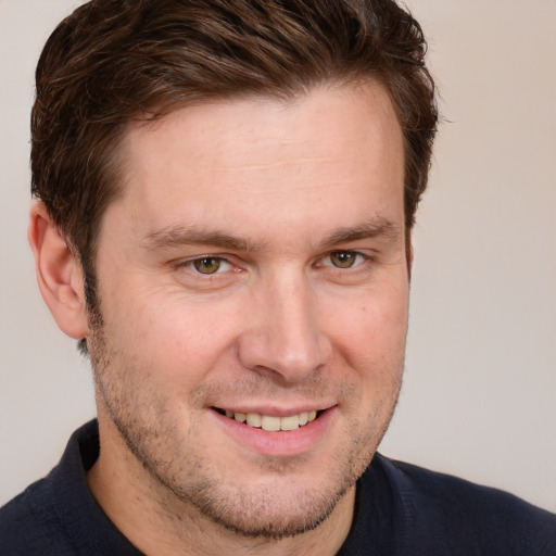 Joyful white adult male with short  brown hair and grey eyes