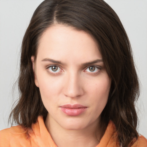 Neutral white young-adult female with medium  brown hair and brown eyes