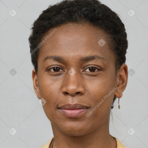 Joyful black young-adult female with short  brown hair and brown eyes