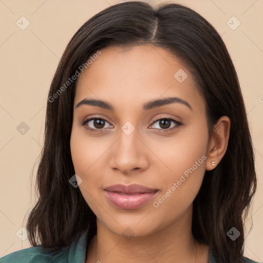 Joyful latino young-adult female with long  brown hair and brown eyes