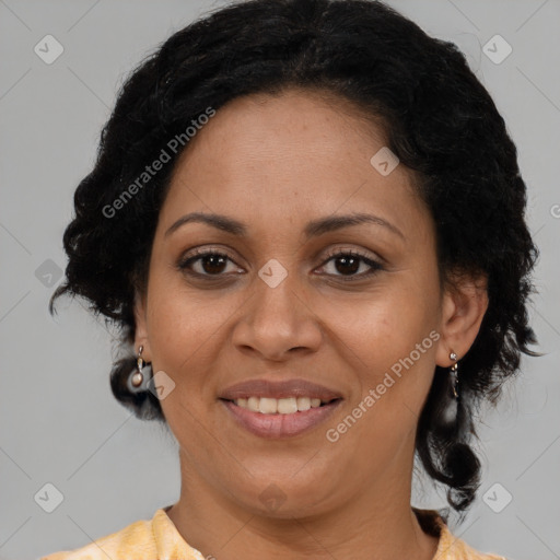 Joyful latino adult female with medium  brown hair and brown eyes