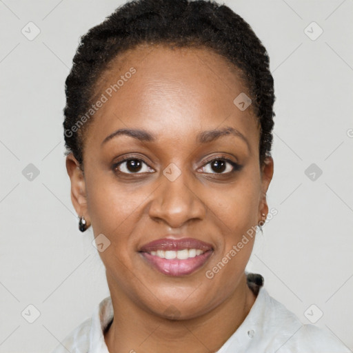 Joyful black young-adult female with short  brown hair and brown eyes