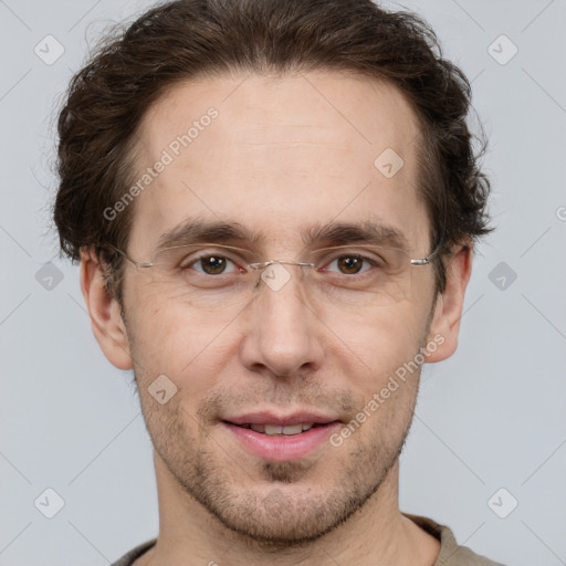 Joyful white adult male with short  brown hair and grey eyes