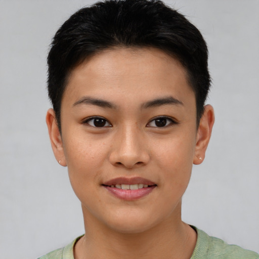 Joyful asian young-adult female with short  brown hair and brown eyes