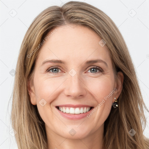 Joyful white young-adult female with long  brown hair and green eyes