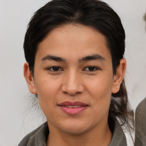 Joyful asian young-adult female with medium  brown hair and brown eyes