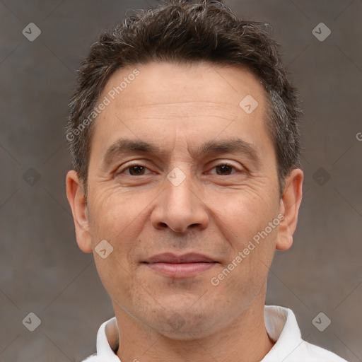 Joyful white adult male with short  brown hair and brown eyes