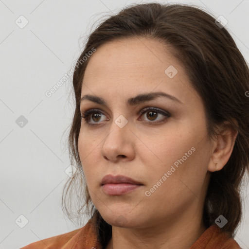 Neutral white young-adult female with long  brown hair and brown eyes