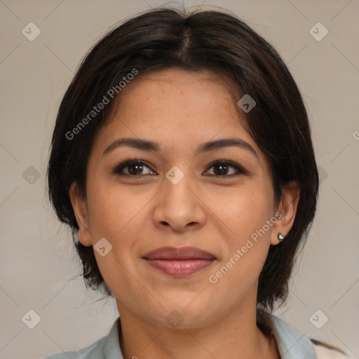 Joyful latino adult female with medium  brown hair and brown eyes