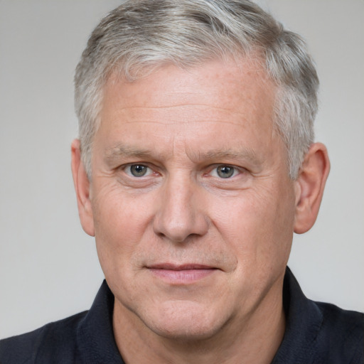 Neutral white middle-aged male with short  gray hair and grey eyes