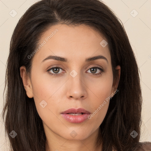 Neutral white young-adult female with long  brown hair and brown eyes