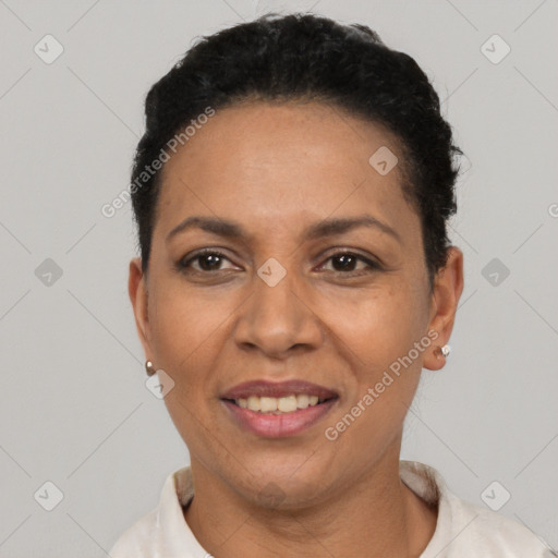 Joyful latino adult female with short  black hair and brown eyes