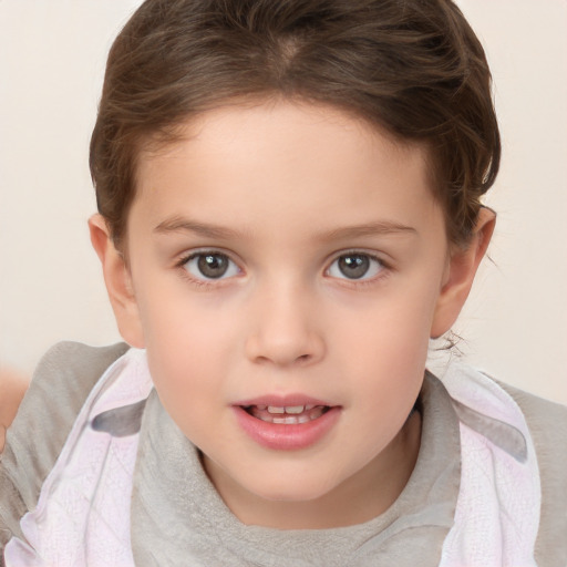 Joyful white child female with short  brown hair and brown eyes