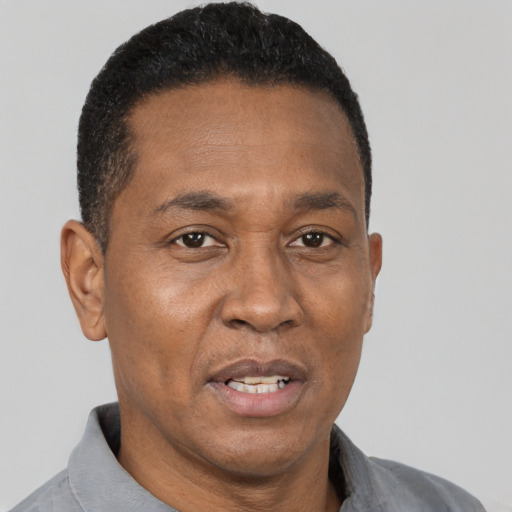 Neutral black adult male with short  brown hair and brown eyes