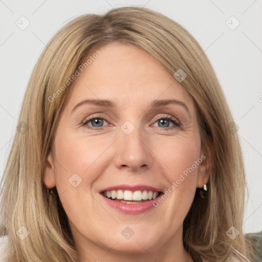 Joyful white young-adult female with long  brown hair and green eyes