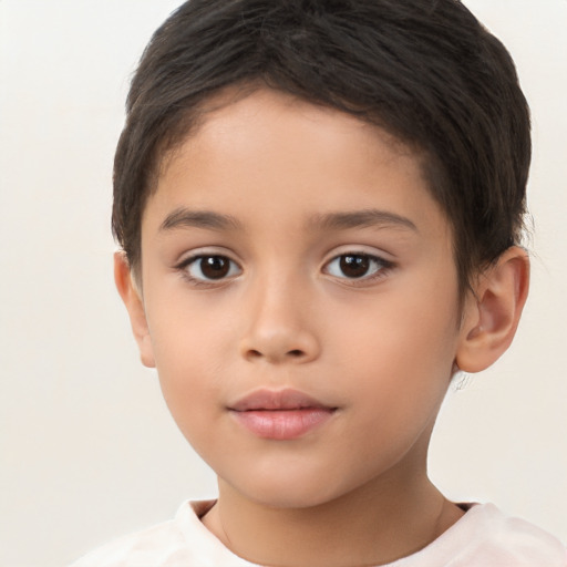 Joyful white child female with short  brown hair and brown eyes