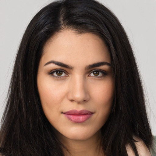 Joyful latino young-adult female with long  brown hair and brown eyes