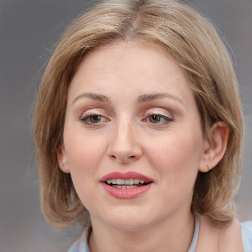 Joyful white young-adult female with medium  brown hair and blue eyes