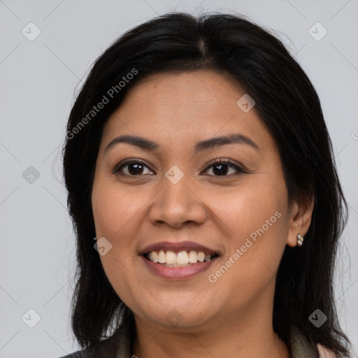 Joyful latino young-adult female with long  brown hair and brown eyes