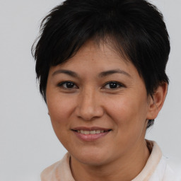 Joyful asian adult female with short  brown hair and brown eyes