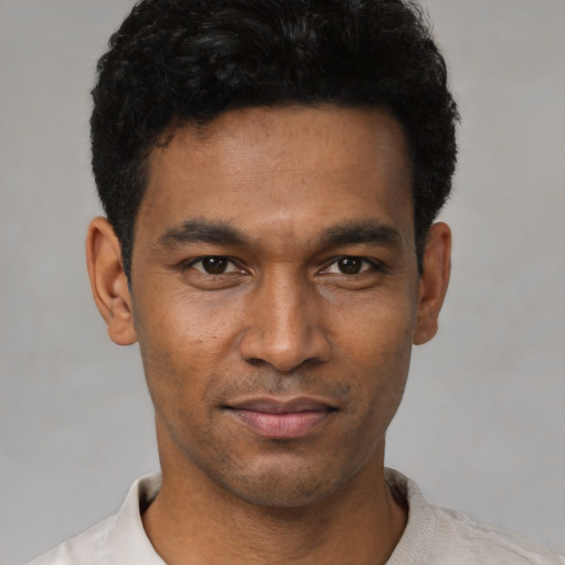 Neutral black young-adult male with short  black hair and brown eyes