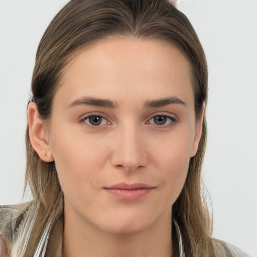 Neutral white young-adult female with long  brown hair and brown eyes