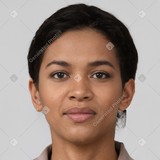 Joyful latino young-adult female with short  black hair and brown eyes