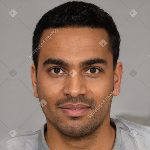 Joyful latino young-adult male with short  black hair and brown eyes