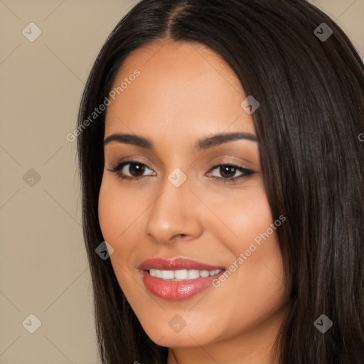 Joyful white young-adult female with long  black hair and brown eyes