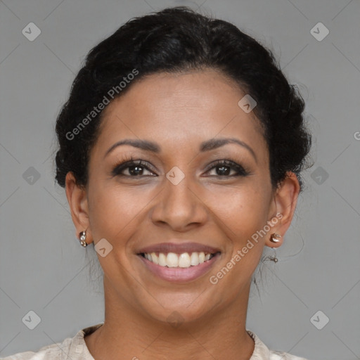 Joyful latino adult female with short  brown hair and brown eyes