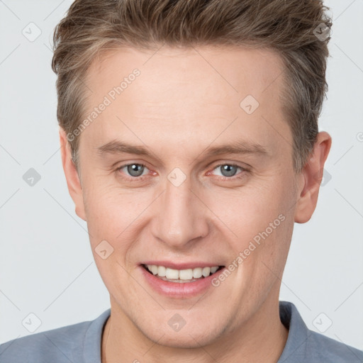 Joyful white adult male with short  brown hair and grey eyes