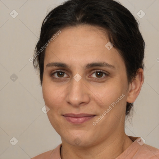 Joyful white adult female with medium  brown hair and brown eyes