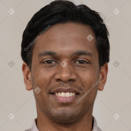 Joyful latino young-adult male with short  black hair and brown eyes