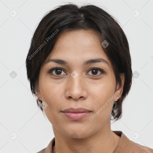 Joyful latino young-adult female with medium  brown hair and brown eyes