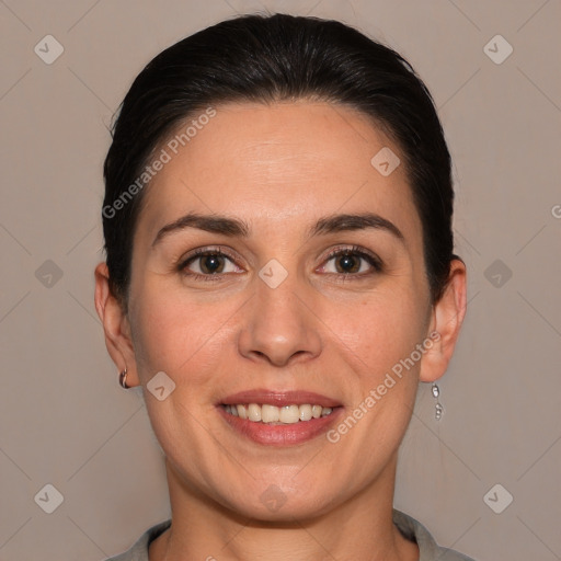 Joyful white adult female with short  brown hair and brown eyes