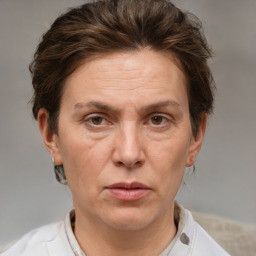 Joyful white adult female with short  brown hair and brown eyes